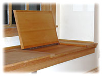 Recessed wall bench with built-in storage with an open lid