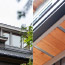 A diptych showing exterior details of the roofline of a modern home.